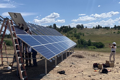 Workers installing a solar power array