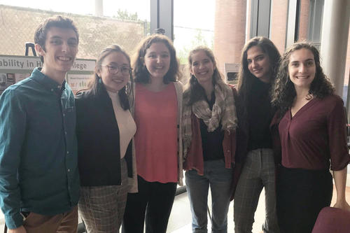 Student liaisons standing together
