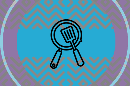 Illustration of a frying pan with a spatula resting inside it