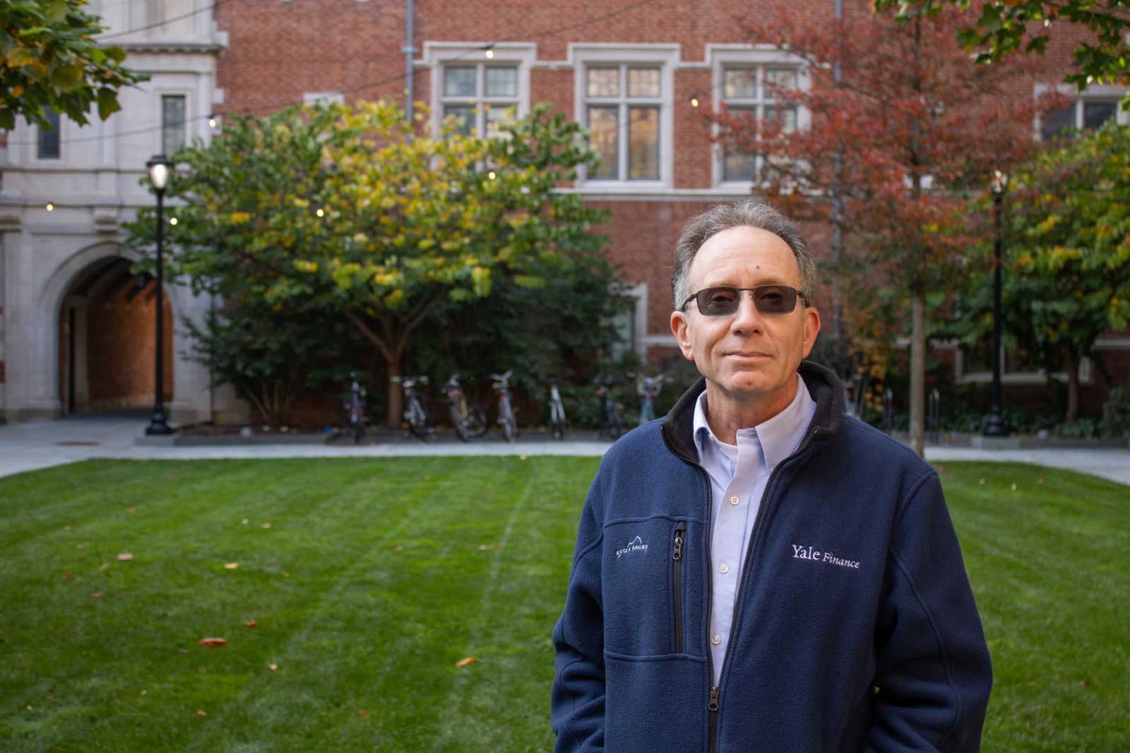 Photo of Joe Mastracchio in the courtyard of Benjamin Franklin College at Yale