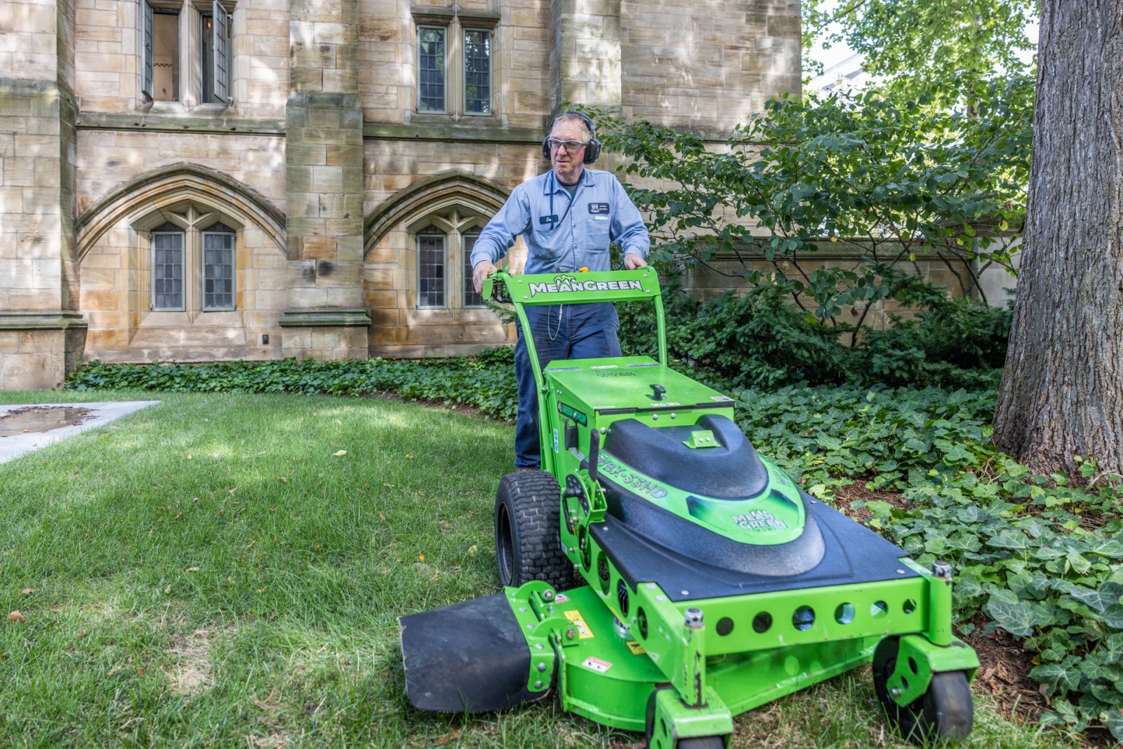 A Yale Landscape and Grounds staff member uses a battery-powered mower.