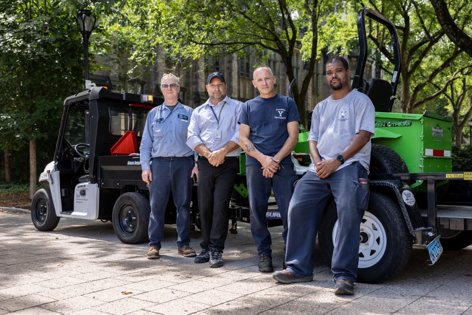 Yale Landscape and Grounds crew with a battery powered EV