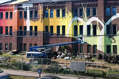 New Haven armory with a colorful new climate mural painted on it