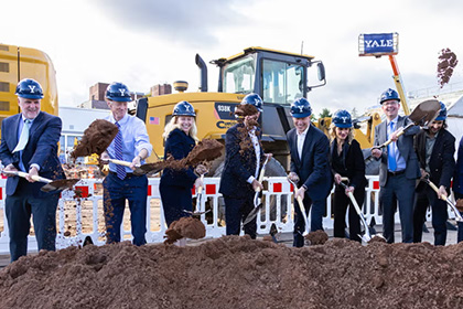 Officials shoveling dirt at a Yale groundbreaking