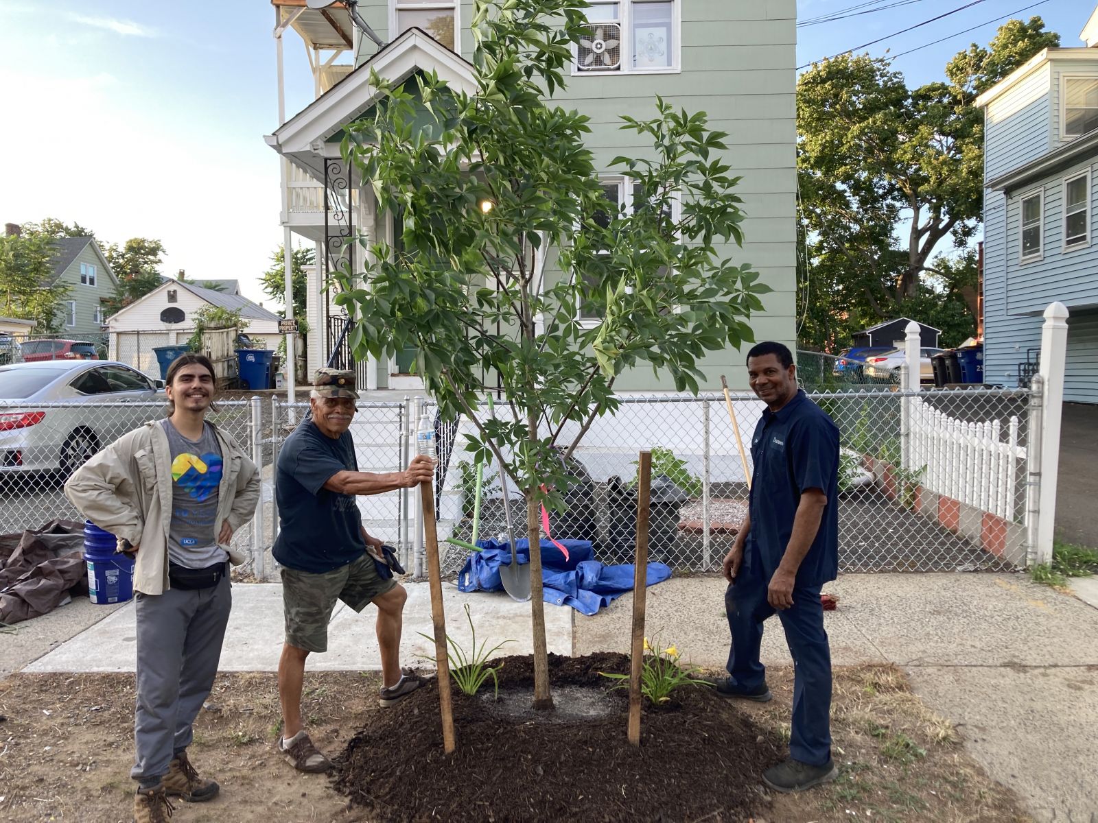 A photo of Urban Resources Initiative volunteers and staff planting a tree in New Haven in July 2022