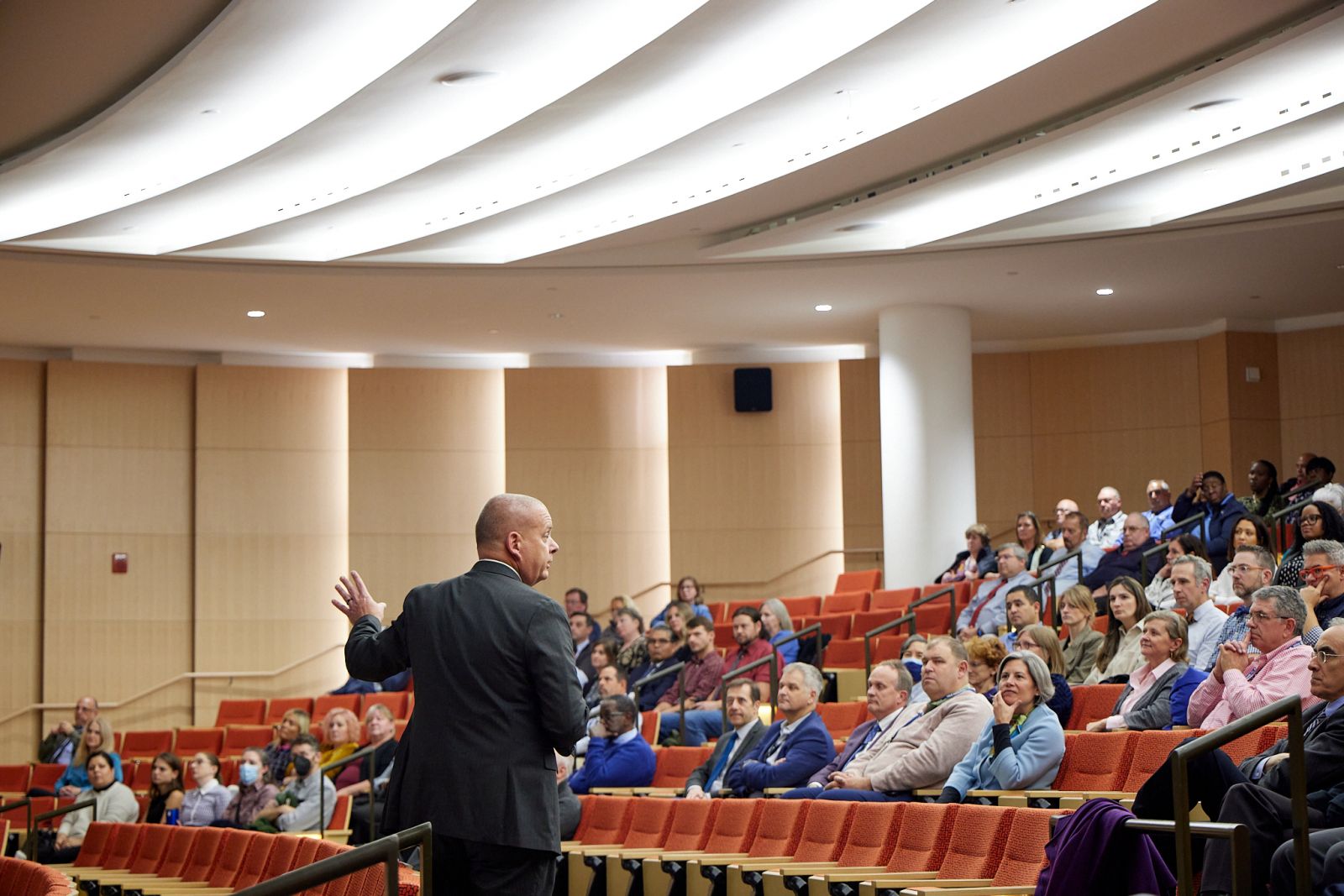 Photo of Yale's Anthony Kosior speaking to auditorium of Facilities Officxe employees