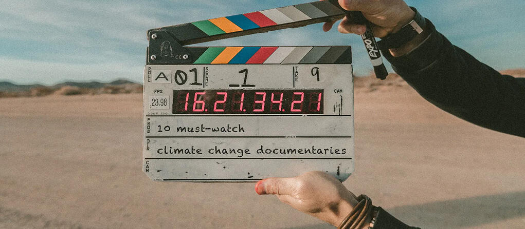 An image of a clapper board with the words "10 must-watch climate change documentaries"