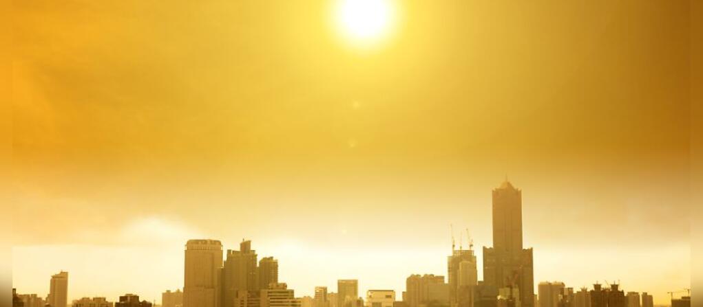 A photo of a city under a sweltering sun