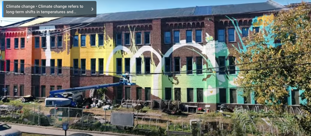 Screen shot from a video about a climate mural painted on the New Haven Armory