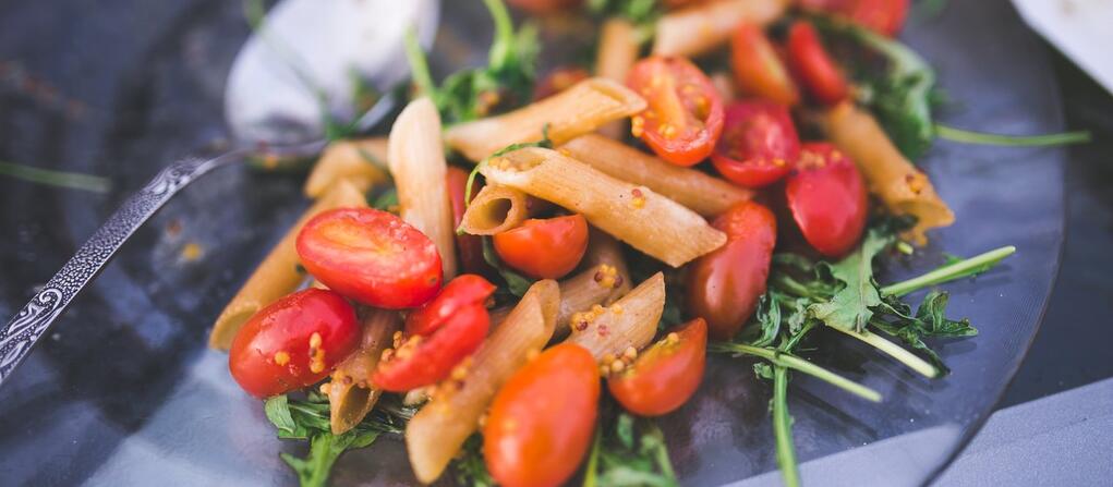 plate with pasta and tomatoes