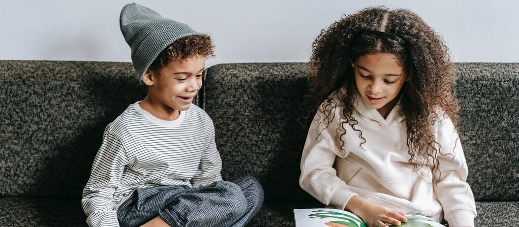 kids reading on a couch