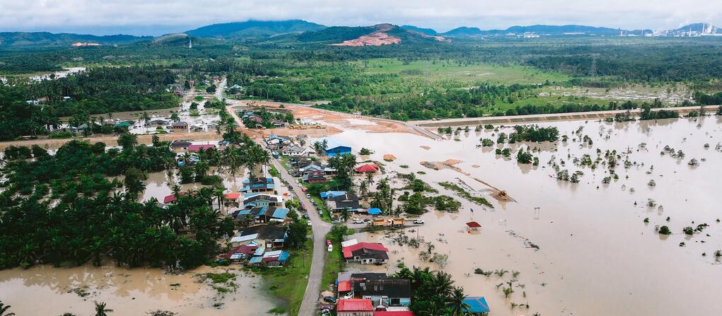 Photo of flooded village and fields