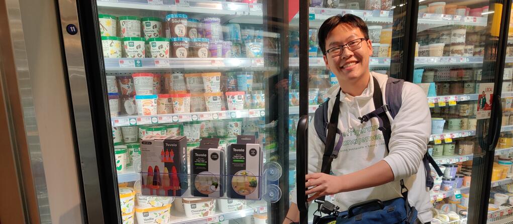Yale student Tilden Chao "sniffs" for refrigerant gas leaks at a drink cooler.