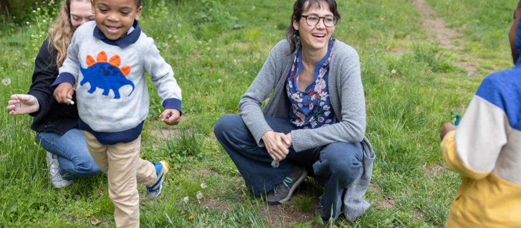 A photo of Anna Pickett of the Yale-affiliated Urban Resources Initiative with participants in the Exploring Nature program