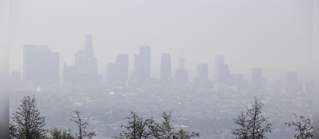 A city skyline blanketed in smog