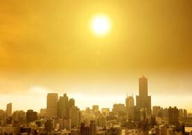 A photo of a city under a sweltering sun
