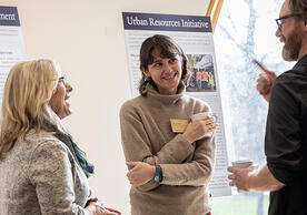 Yale colleagues talking at a poster session in April 2025
