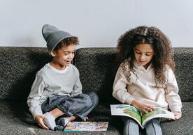 kids reading on a couch